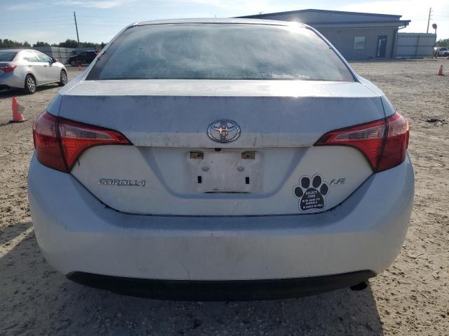 Photo 5 VIN: 5YFBURHE5KP869185 - TOYOTA COROLLA L 