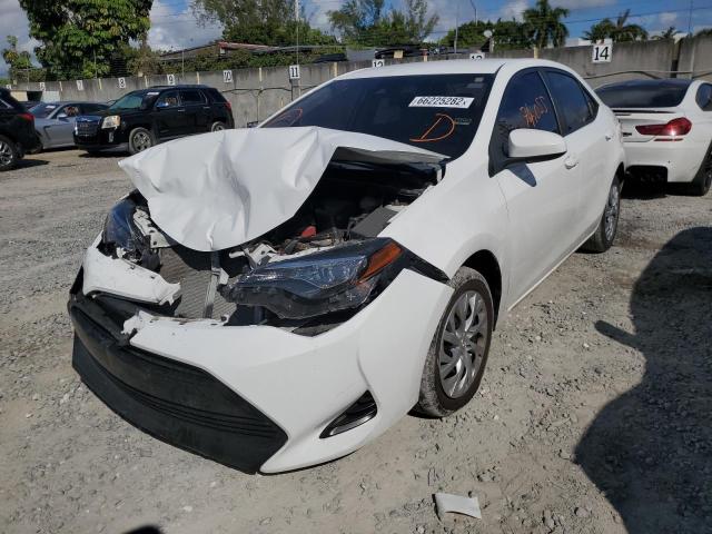 Photo 1 VIN: 5YFBURHE5KP879425 - TOYOTA COROLLA L 