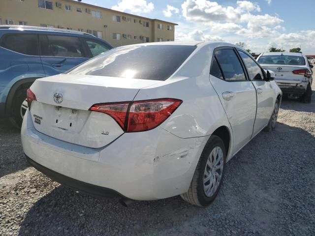 Photo 3 VIN: 5YFBURHE5KP879425 - TOYOTA COROLLA L 