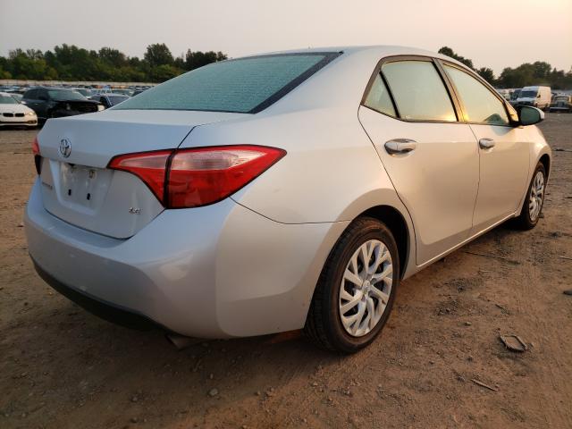 Photo 3 VIN: 5YFBURHE5KP885094 - TOYOTA COROLLA L 