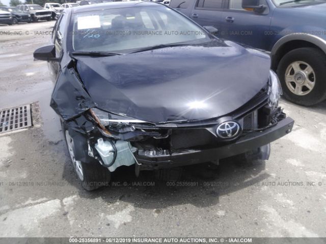 Photo 5 VIN: 5YFBURHE5KP891560 - TOYOTA COROLLA 