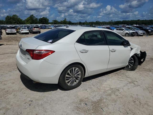 Photo 2 VIN: 5YFBURHE5KP901228 - TOYOTA COROLLA L 