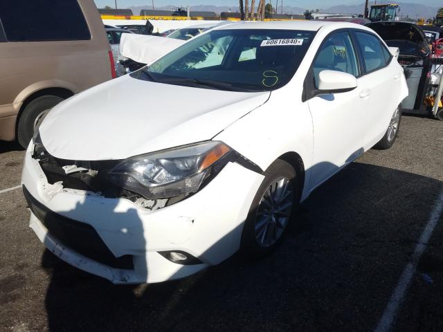 Photo 1 VIN: 5YFBURHE6EP059889 - TOYOTA COROLLA L 