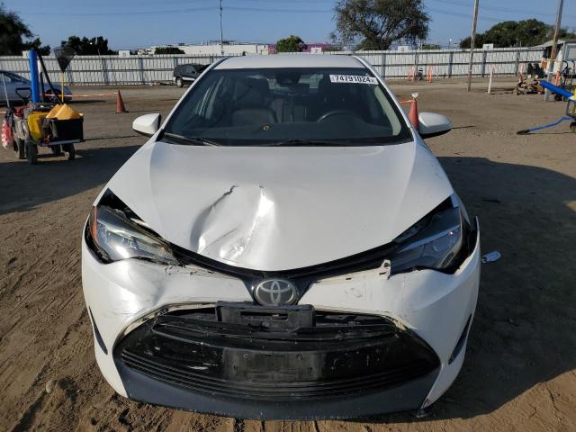 Photo 4 VIN: 5YFBURHE6HP679789 - TOYOTA COROLLA L 