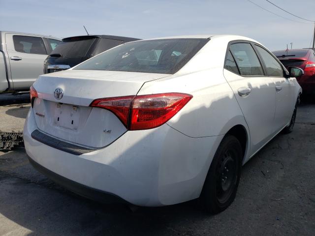 Photo 3 VIN: 5YFBURHE6KP857174 - TOYOTA COROLLA L 