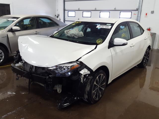 Photo 1 VIN: 5YFBURHE6KP864058 - TOYOTA COROLLA L 