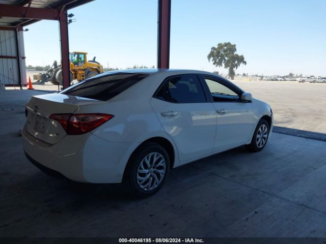 Photo 3 VIN: 5YFBURHE6KP867056 - TOYOTA COROLLA 