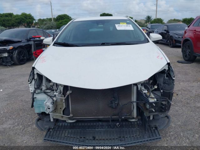 Photo 5 VIN: 5YFBURHE6KP878901 - TOYOTA COROLLA 