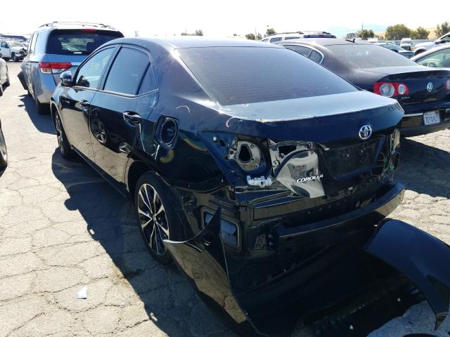 Photo 2 VIN: 5YFBURHE6KP885329 - TOYOTA COROLLA L 