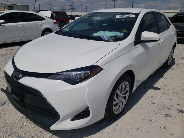 Photo 1 VIN: 5YFBURHE6KP885797 - TOYOTA COROLLA L 