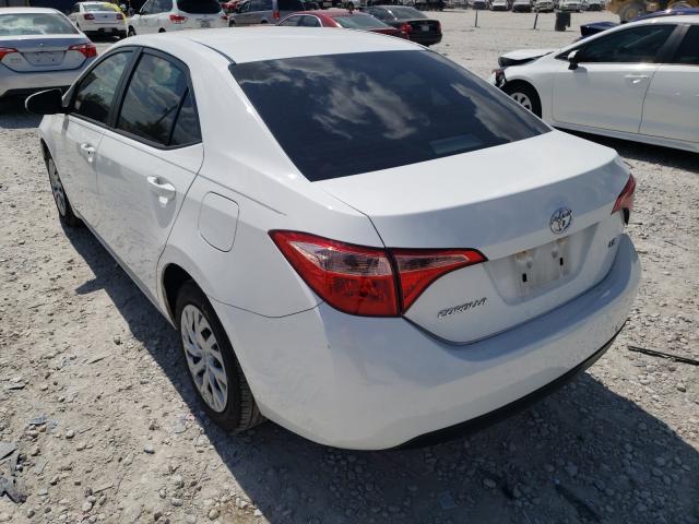 Photo 2 VIN: 5YFBURHE6KP885797 - TOYOTA COROLLA L 