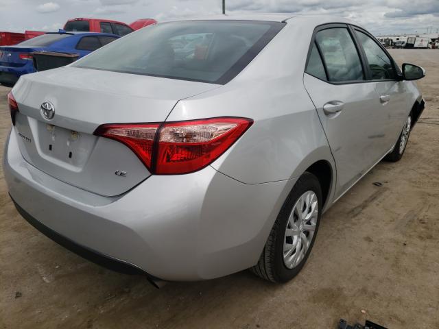 Photo 3 VIN: 5YFBURHE6KP889879 - TOYOTA COROLLA L 