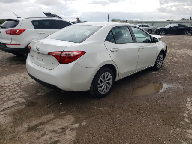 Photo 3 VIN: 5YFBURHE6KP890739 - TOYOTA COROLLA L 