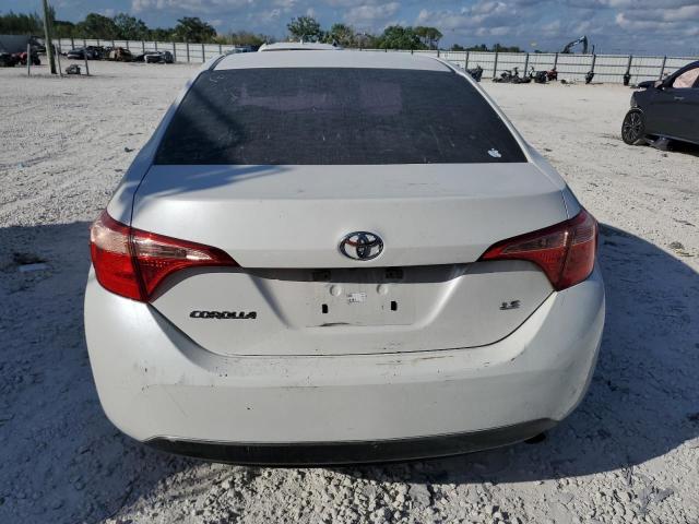 Photo 5 VIN: 5YFBURHE6KP896637 - TOYOTA COROLLA L 