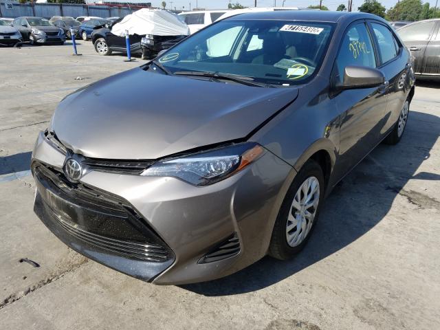 Photo 1 VIN: 5YFBURHE6KP910424 - TOYOTA COROLLA L 