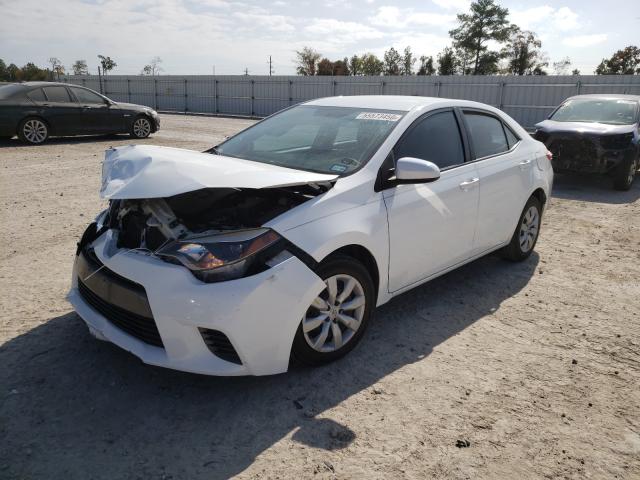 Photo 1 VIN: 5YFBURHE7GP450634 - TOYOTA COROLLA L 