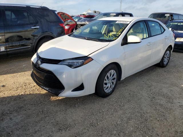 Photo 1 VIN: 5YFBURHE7HP696052 - TOYOTA COROLLA L 