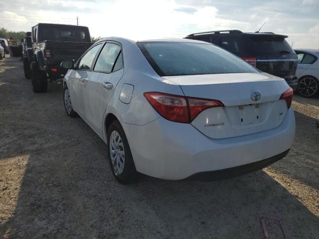 Photo 2 VIN: 5YFBURHE7HP696052 - TOYOTA COROLLA L 