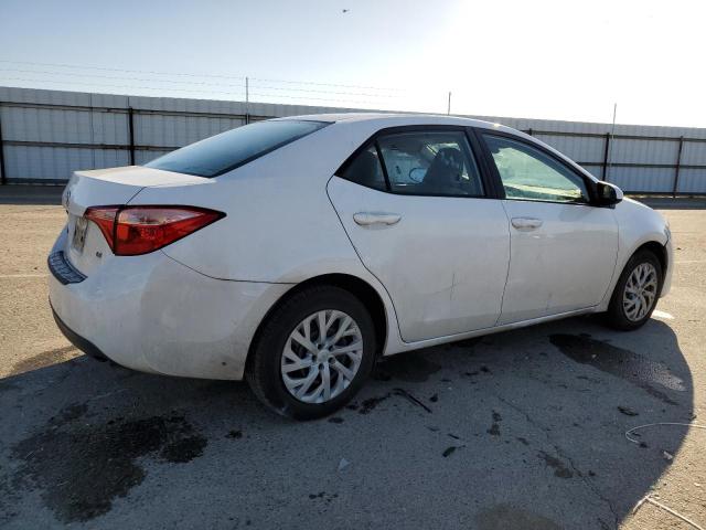 Photo 2 VIN: 5YFBURHE7HP712010 - TOYOTA COROLLA L 