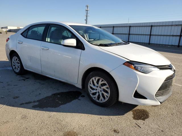 Photo 3 VIN: 5YFBURHE7HP712010 - TOYOTA COROLLA L 