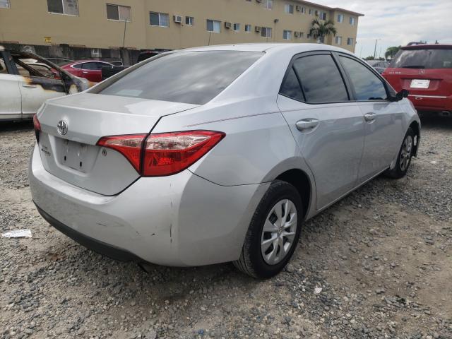 Photo 3 VIN: 5YFBURHE7JP760158 - TOYOTA COROLLA L 