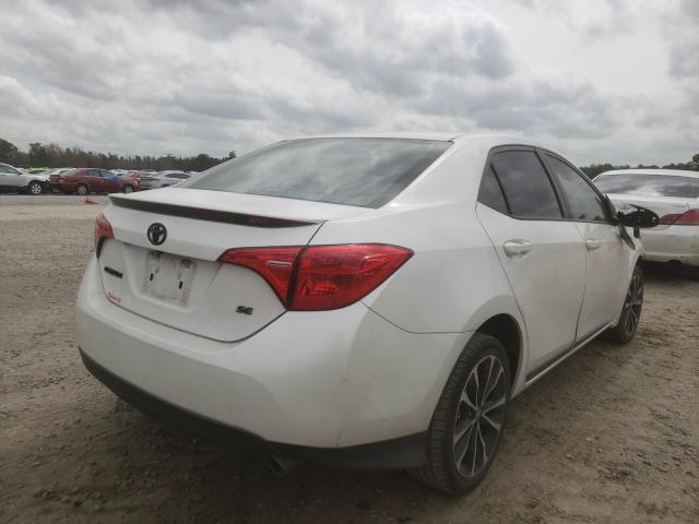 Photo 3 VIN: 5YFBURHE7JP769863 - TOYOTA COROLLA L 