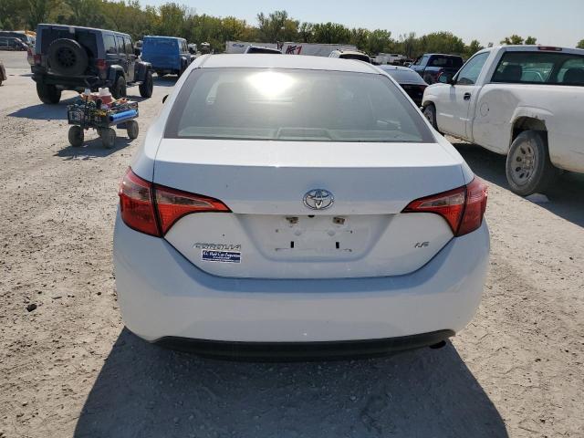 Photo 5 VIN: 5YFBURHE7JP784881 - TOYOTA COROLLA L 