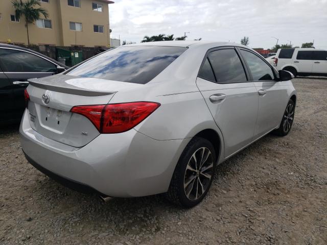 Photo 3 VIN: 5YFBURHE7JP838678 - TOYOTA COROLLA L 