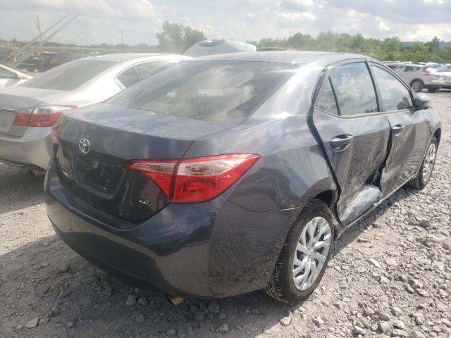 Photo 3 VIN: 5YFBURHE7KP864490 - TOYOTA COROLLA L 