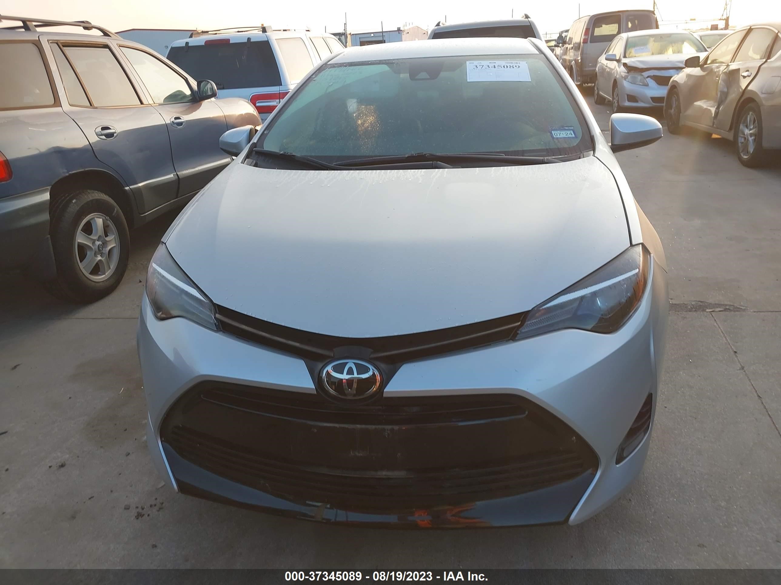 Photo 11 VIN: 5YFBURHE7KP874615 - TOYOTA COROLLA 