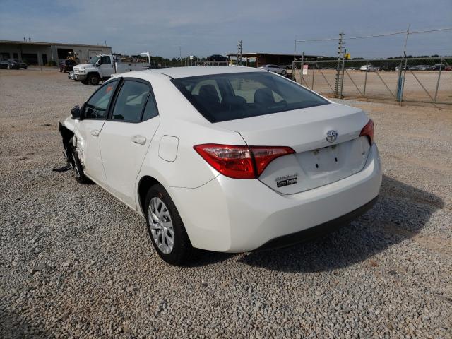 Photo 2 VIN: 5YFBURHE7KP884450 - TOYOTA COROLLA L 