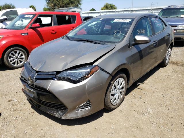 Photo 1 VIN: 5YFBURHE7KP886893 - TOYOTA COROLLA L 