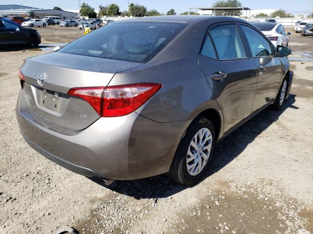 Photo 3 VIN: 5YFBURHE7KP891107 - TOYOTA COROLLA L 