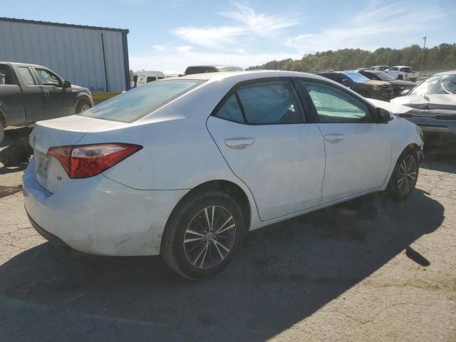 Photo 2 VIN: 5YFBURHE7KP891222 - TOYOTA COROLLA L 