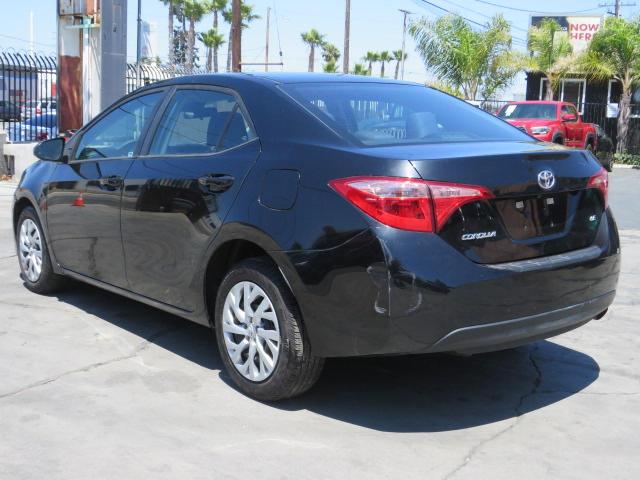 Photo 3 VIN: 5YFBURHE7KP892872 - TOYOTA COROLLA L 