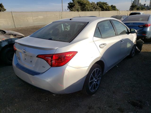 Photo 3 VIN: 5YFBURHE8HP599815 - TOYOTA COROLLA L 