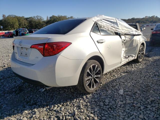 Photo 3 VIN: 5YFBURHE8HP688445 - TOYOTA COROLLA L 