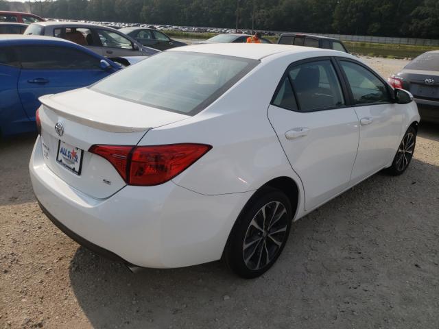 Photo 3 VIN: 5YFBURHE8HP689241 - TOYOTA COROLLA L 