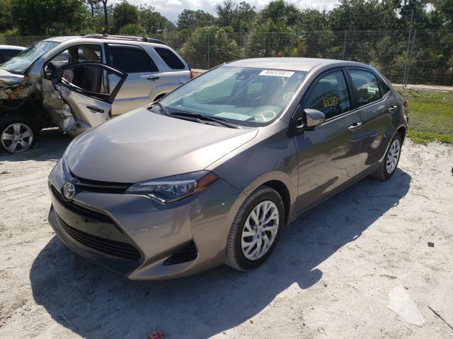 Photo 1 VIN: 5YFBURHE8JP808976 - TOYOTA COROLLA L 