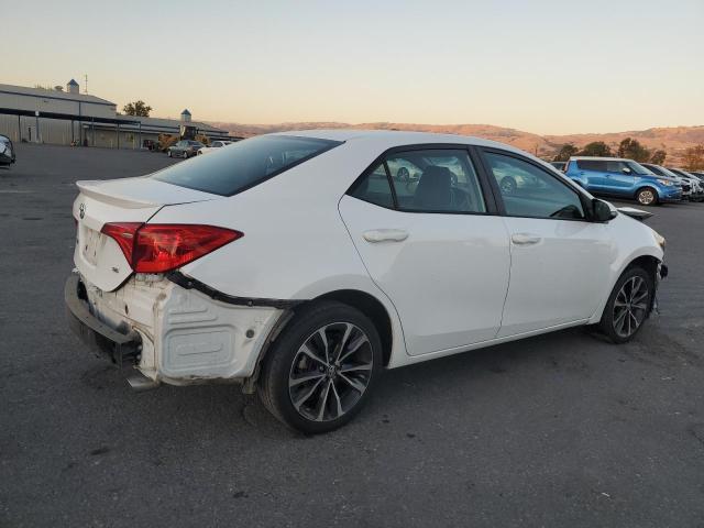 Photo 2 VIN: 5YFBURHE8KP856379 - TOYOTA COROLLA L 