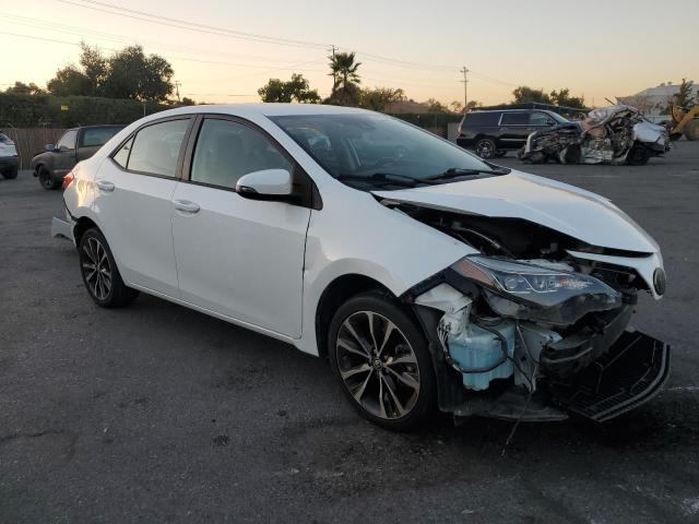 Photo 3 VIN: 5YFBURHE8KP856379 - TOYOTA COROLLA L 