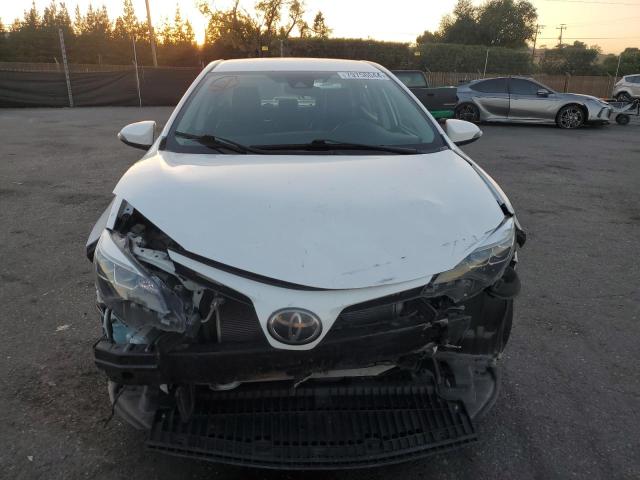 Photo 4 VIN: 5YFBURHE8KP856379 - TOYOTA COROLLA L 