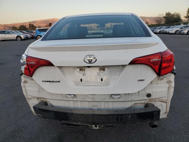 Photo 5 VIN: 5YFBURHE8KP856379 - TOYOTA COROLLA L 