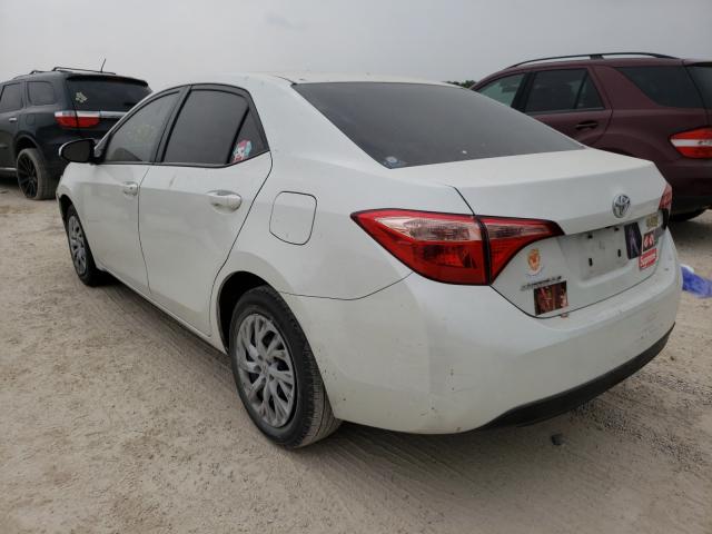 Photo 2 VIN: 5YFBURHE8KP857113 - TOYOTA COROLLA L 