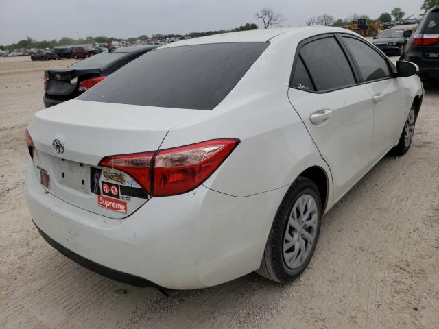 Photo 3 VIN: 5YFBURHE8KP857113 - TOYOTA COROLLA L 