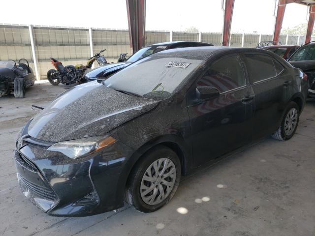 Photo 1 VIN: 5YFBURHE8KP858553 - TOYOTA COROLLA L 