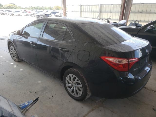 Photo 2 VIN: 5YFBURHE8KP858553 - TOYOTA COROLLA L 