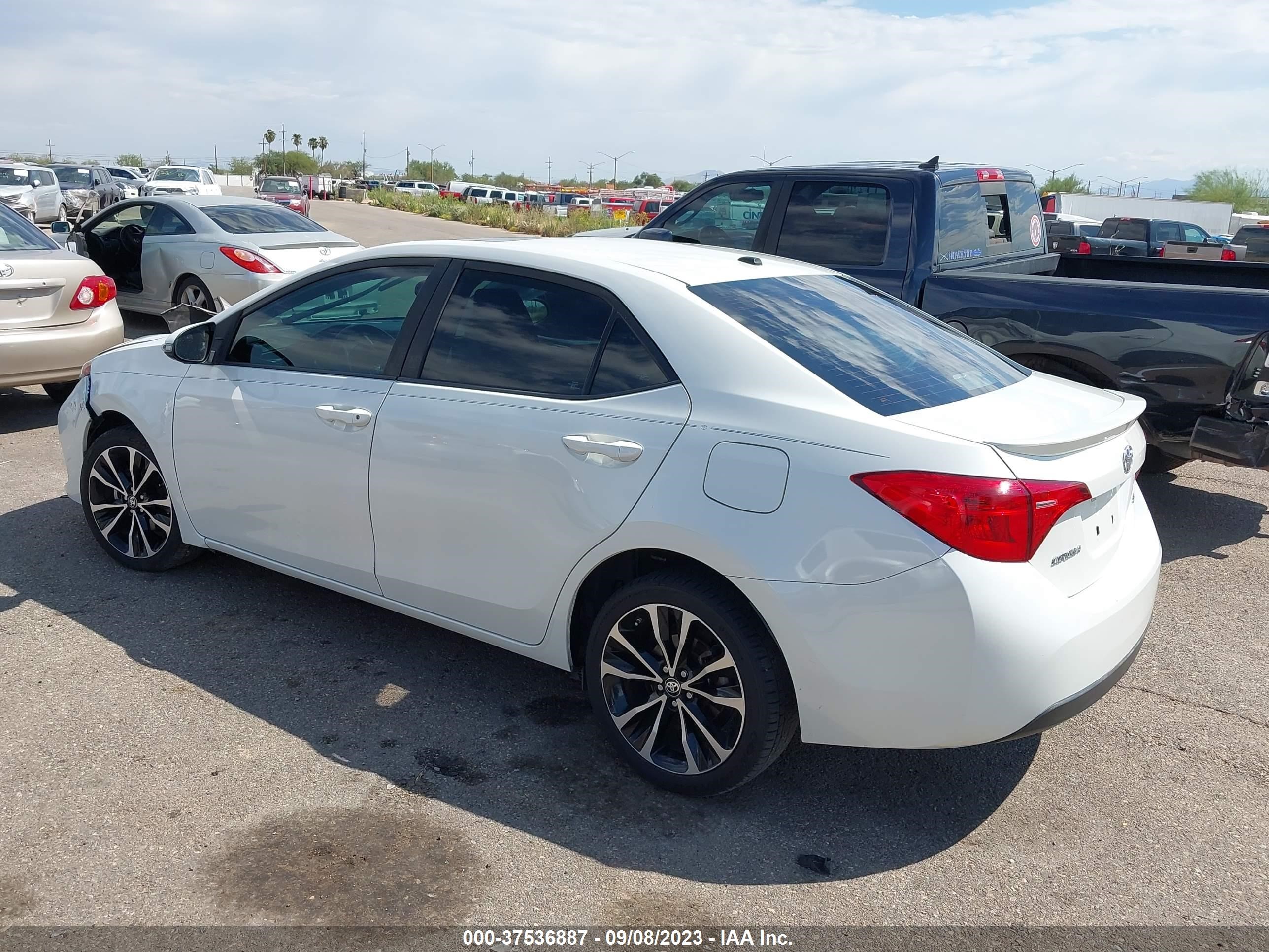 Photo 2 VIN: 5YFBURHE8KP868130 - TOYOTA COROLLA 