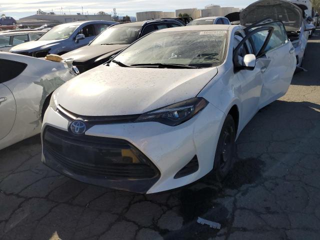 Photo 1 VIN: 5YFBURHE8KP869522 - TOYOTA COROLLA L 