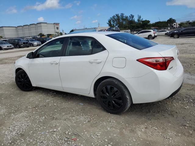 Photo 1 VIN: 5YFBURHE8KP878947 - TOYOTA COROLLA L 